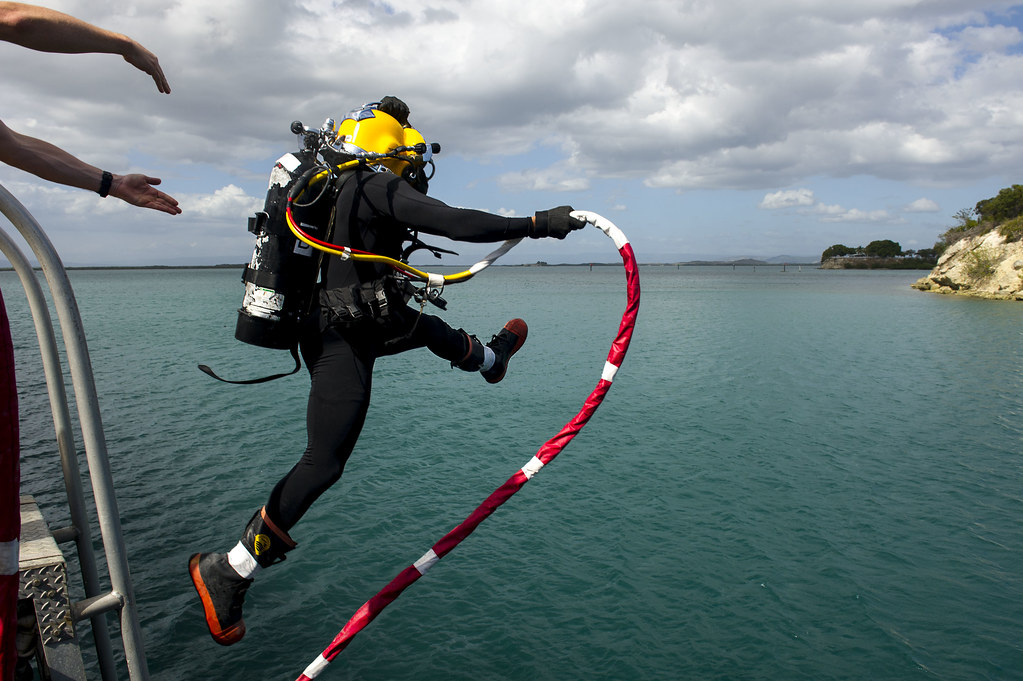 Navy diver underwater inspection close visual survey